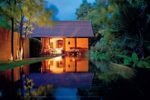 a house with a pool of water in front of it at Phulay Bay, A Ritz-Carlton Reserve in Tab Kaek Beach