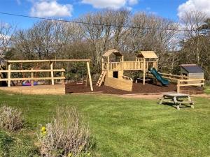 a park with a playground with a slide and a table at Buttercup - Uk45986 in Paul