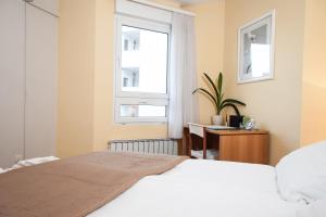 Postel nebo postele na pokoji v ubytování Apartment Avenue