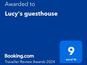 a screenshot of a cell phone with the text awarded to lugleys guest house at Lucy's guesthouse in La Digue