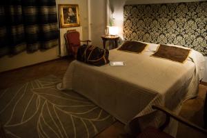 Gulta vai gultas numurā naktsmītnē Residenza Russo Luxury Home Salerno