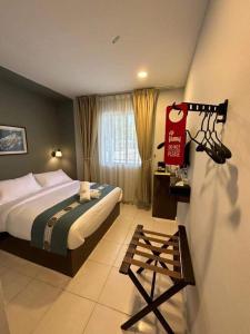Postel nebo postele na pokoji v ubytování R Hotel Langkawi