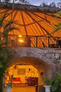 a room with a stone building with an archway at Orchid Inn at Montego West Village in Montego Bay
