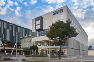 a building with a sign on the side of it at City Express by Marriott La Raza in Mexico City