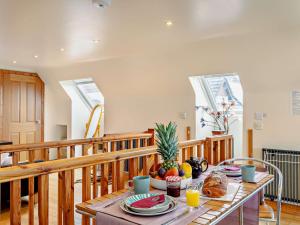 a table with food on top of a balcony at 1 bed in Barnstaple ELLCO in Fremington