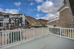 a balcony with a white fence and buildings at Resort Plaza 5012 by AvantStay Located in Park City Mountain Resort w Mountain Views in Park City