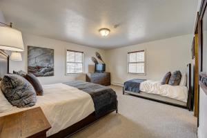 a bedroom with two beds and a television in it at Resort Plaza 5012 by AvantStay Located in Park City Mountain Resort w Mountain Views in Park City