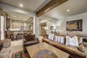 a living room with a couch and a kitchen at Mont Cervin 24 by AvantStay Luxury Ski in Ski out home in Park City in Park City