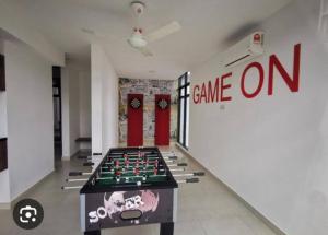 a room with a game room with a chess board at 3 Bedrooms -Astetica-The Mines in Seri Kembangan +1 photo