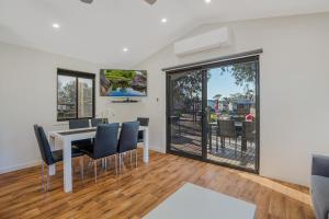 a dining room with a white table and chairs at BIG4 Bendigo Marong Holiday Park in Marong