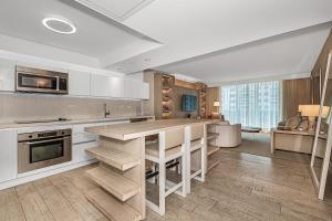 a kitchen with a large island in a room at 1 Hotel Modern King Suite 1BR 1 5BA w Ocean View in Miami Beach