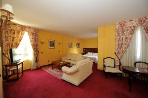 Postel nebo postele na pokoji v ubytování Hotel Lozano