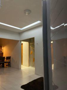a living room with a hallway with a ceiling at New House Temporada in João Pessoa