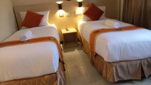 Cama ou camas em um quarto em bintang hotel