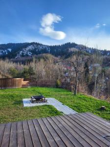 a bench sitting on top of a wooden deck at Country House in Kamenskoye Plato