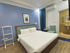 Giường trong phòng chung tại A25 Hotel - 109 Trúc Bạch