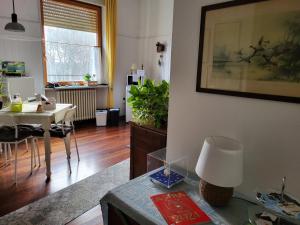 a living room with a table and a dining room at B&B Bondi in Ravenna