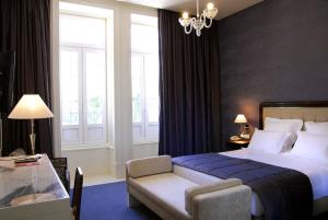 Postel nebo postele na pokoji v ubytování Curia Palace Hotel & Spa