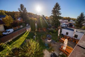 an aerial view of a backyard with a table and chairs at Wellness Hotel Valnovka in Kamenice +33 photos