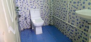 a bathroom with a toilet and a sink at Dhim Farmstay in Namchi