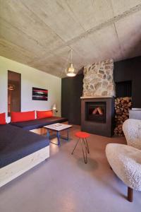 a room with a living room with a fireplace at Alpenchalet Walchensee in Walchensee