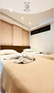 Llit o llits en una habitació de TABATINGA RESIDENÇE SERVIÇE Flats Beach Tabatinga