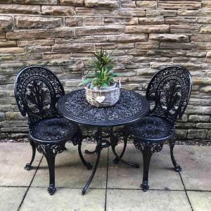 a table and two chairs with a potted plant on it at Studio 77 - Central. Free on street parking. in Sheffield