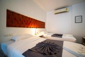 Ένα ή περισσότερα κρεβάτια σε δωμάτιο στο Helens hotel