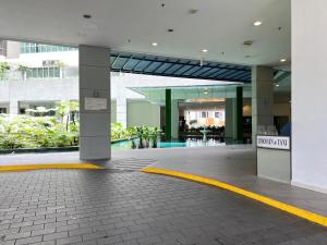 a lobby of a building with a sign that reads mystery fix at Regalia Spritz Empire Hostel in Kuala Lumpur