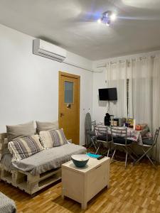 a living room with a couch and a table at Sol y Luna "Desayuno Incluido" in Manzaneque