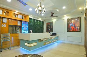 a large lobby with a counter in a store at Hotel Glow Inn Paharganj-3 Mins Walk From New Delhi Railway Station in New Delhi