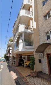 a building with a balcony on the side of it at Premium Apartment In Chalkida in Chalkida