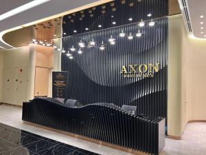 a lobby with a row of chairs in a building at AXON RESIDENCE KLCC BY JD in Kuala Lumpur