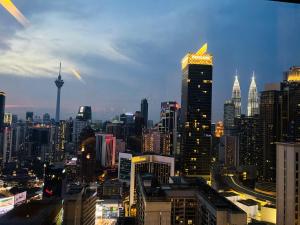a view of a city skyline with tall buildings at AXON RESIDENCE KLCC BY JD in Kuala Lumpur