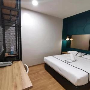 Postel nebo postele na pokoji v ubytování Smile Hotel Selayang Point
