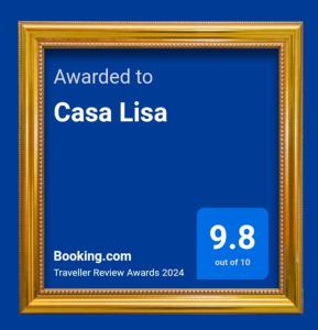 a gold picture frame with a blue background at Casa Lisa in Finale Ligure