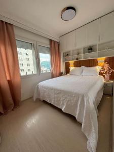 a bedroom with a large bed and a window at Main Square Heaven in Skopje