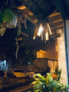 a building with a light hanging from the ceiling at Hostel-John Cafe and Beer in Da Lat