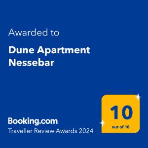 un letrero amarillo que lee otorgado a la barra de comedor del apartamento dume en Dune Apartment Nessebar en Nesebar