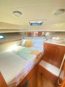 a large bed in the middle of a boat at Yacht y fiestas in Barcelona