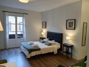 Postel nebo postele na pokoji v ubytování Colom Apartments