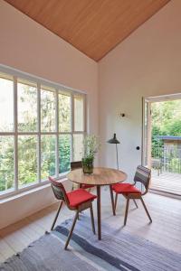 a dining room with a table and two chairs at Urfeld26 Walchensee Berghaus mit Sauna in Urfeld