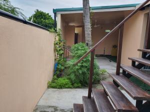 a set of stairs leading up to a building at Tropical stay Thulusdhoo in Thulusdhoo