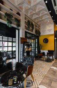 a lobby of a store with chairs and tables at Limon Inn Hotel, Taşucu in Tasucu