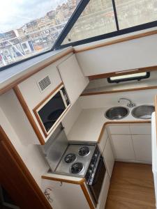an overhead view of a kitchen on a boat at Yacht y fiestas in Barcelona