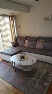 a living room with a couch and a coffee table at Masters bedroom in a 3 bedroom house in Tettenhall