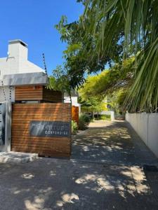 a brick building with a sign on the side of it at Luxury Townhouse in Stellenbosch CENTRAL (BACK-UP POWER) in Stellenbosch +9 photos