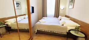Posteľ alebo postele v izbe v ubytovaní Budapest Csaszar Hotel + 30 fotografií