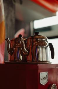 a copper tea kettle sitting on top of a stove at Limon Inn Hotel, Taşucu in Tasucu