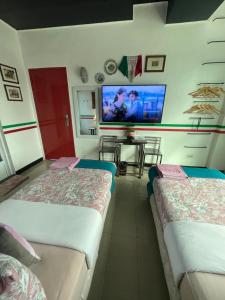 Postel nebo postele na pokoji v ubytování Italy Condotel Darasa